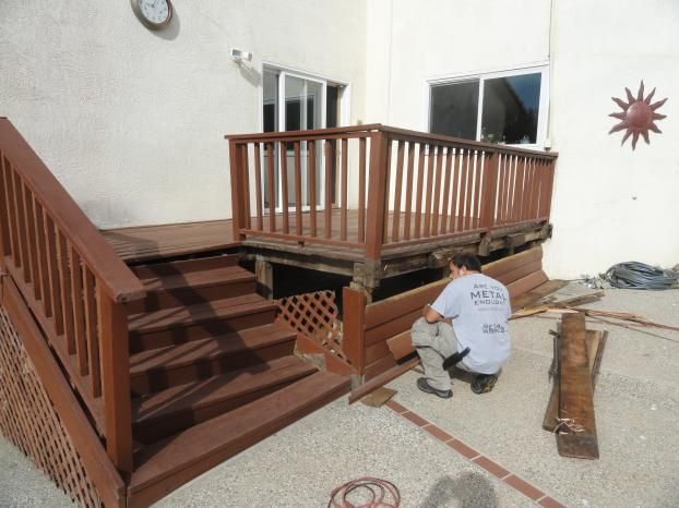 Before a completed deck installation company project in the  area